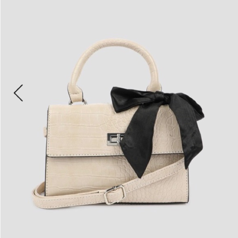 Elegant Cream Handbag with Black Bow